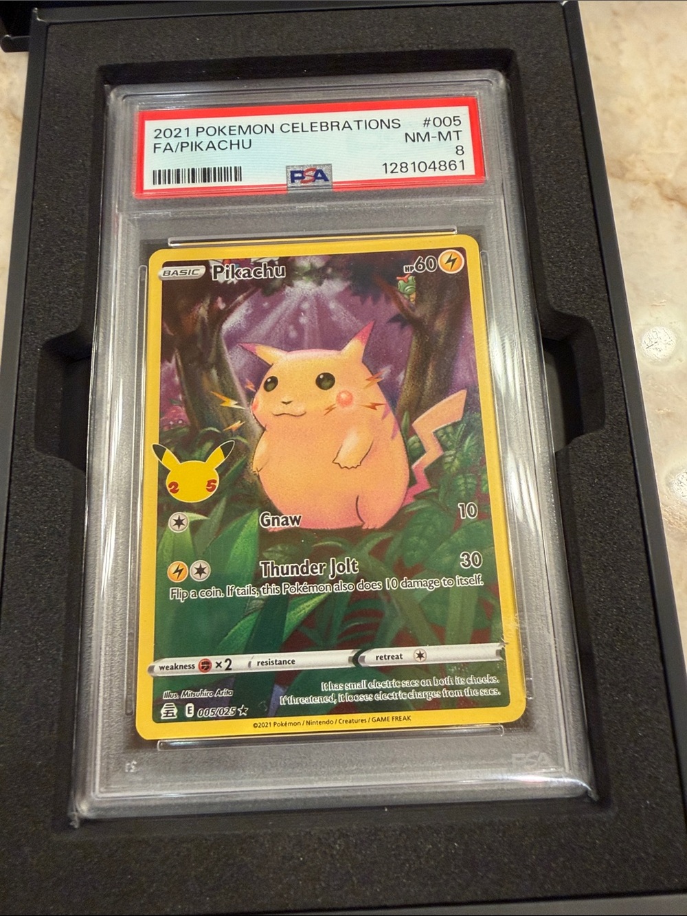 Authentic collectible 2021 Pokémon celebrations #005, graded 8